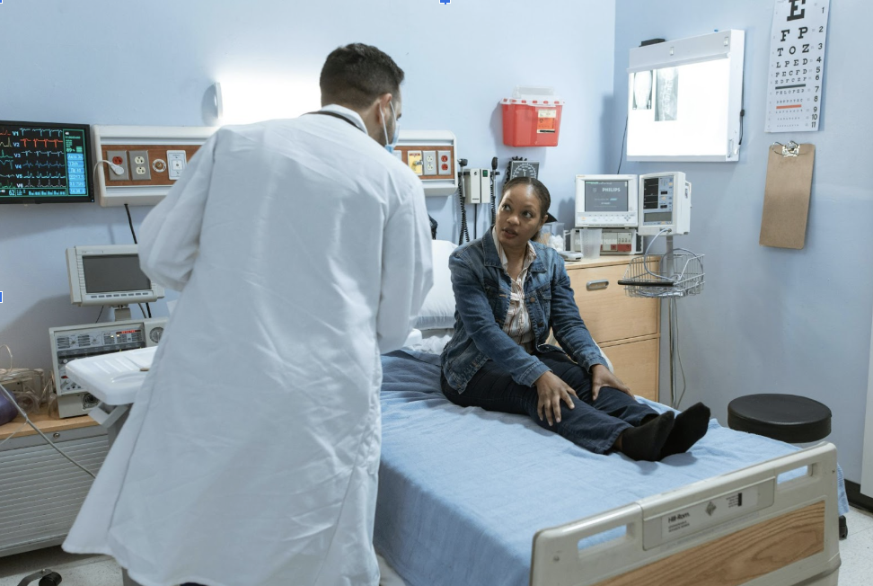 Patient consulting with doctor after an accident-related injury